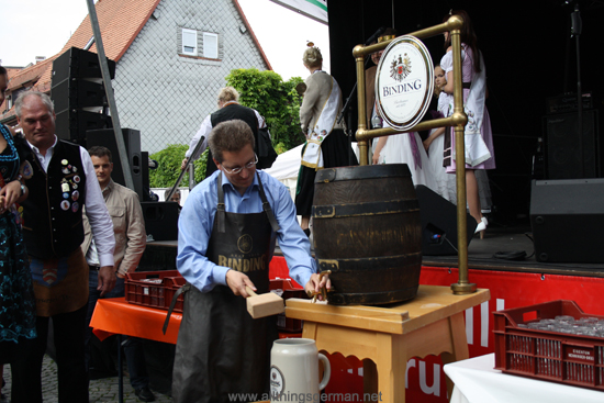 Alderman Christof Fink tapping a barrel of beer to open the Brunnenfest (Fountain Festival) 2012 in Oberursel