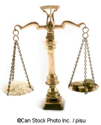 A pair of scales with rice and coins - ©Can Stock Photo Inc. / pisu