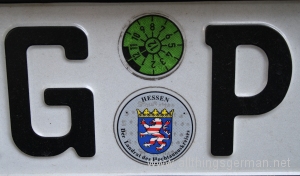 An M.O.T. sticker on a German number plate