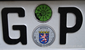 An M.O.T. sticker on a German number plate An M.O.T. sticker on a German number plate