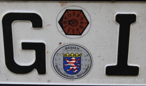 A German numberplate with emissions test sticker still in place A German numberplate with emissions test sticker still in place