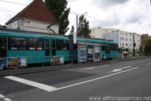 A U3 train waits to cross Kupferhammerweg in Oberursel during the Hessentag