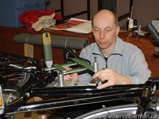 Andreas Ripken (ADFC) engraving a cycle frame during Tag des Fahrrads in Oberursel, February 2012