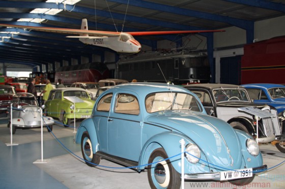 Cars and a glider inside the Railway and Technical Museum on Ruegen