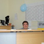 Manuela Eich at the desk in the entrance to the new volunteers' office