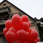 Red balloons in front of the library