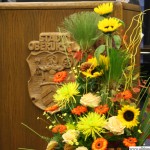 Flowers and the town's crest