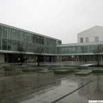 The courtyard among the new buildings with skylights from the sports hall