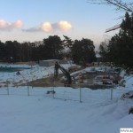 Building work continues in the snow on the new indoor pool