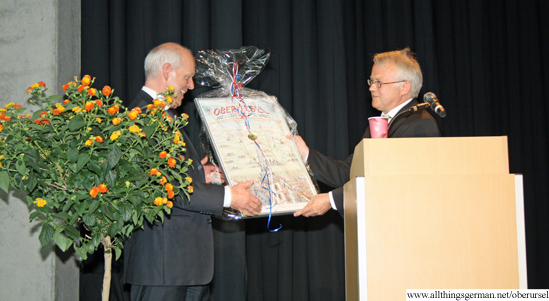 Mayor Hans-Georg Brum (right) handing over a Birthday present from the town to Headmaster Volker Raeuber Mayor Hans-Georg Brum (right) handing over a Birthday present from the town to Headmaster Volker Raeuber