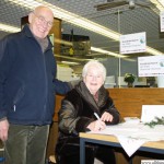 Ursula and Heribert Didden signing the petition for the Yang Family