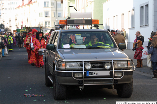 The Verkehrsüberwachungsclub at  the head of the 2015 carnival parade as it passes through the Henchenstraße