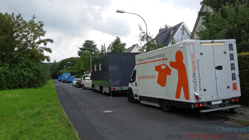 Vehicles from the film unit parked in the Altenhöferweg during filming in August 2016