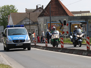 Police clear the road for the cycle race