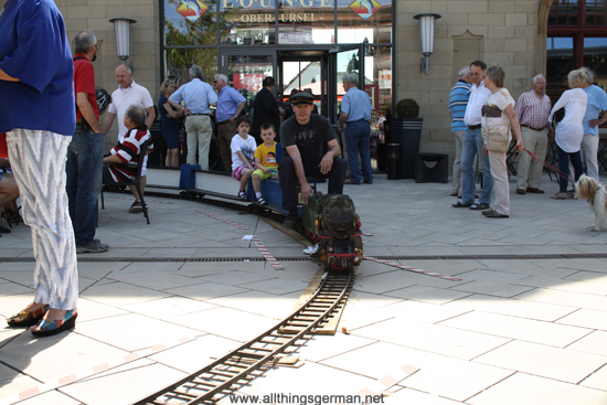 The miniature steam train in front of the Lounge entrance