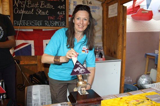 June Smith pulling a pint at the Rushmoor stand in the Weidengasse