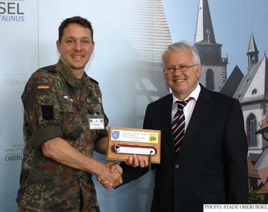 Oberstleutnant (Lieutenant Colonel) Uhlig presenting the Town Key to Mayor Hans-Georg Brum